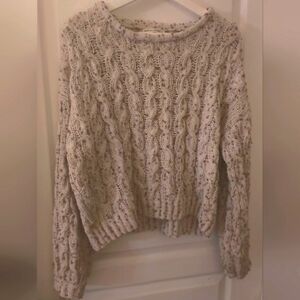 Beautiful ivory cream colored knitted sweater with small balls of different past